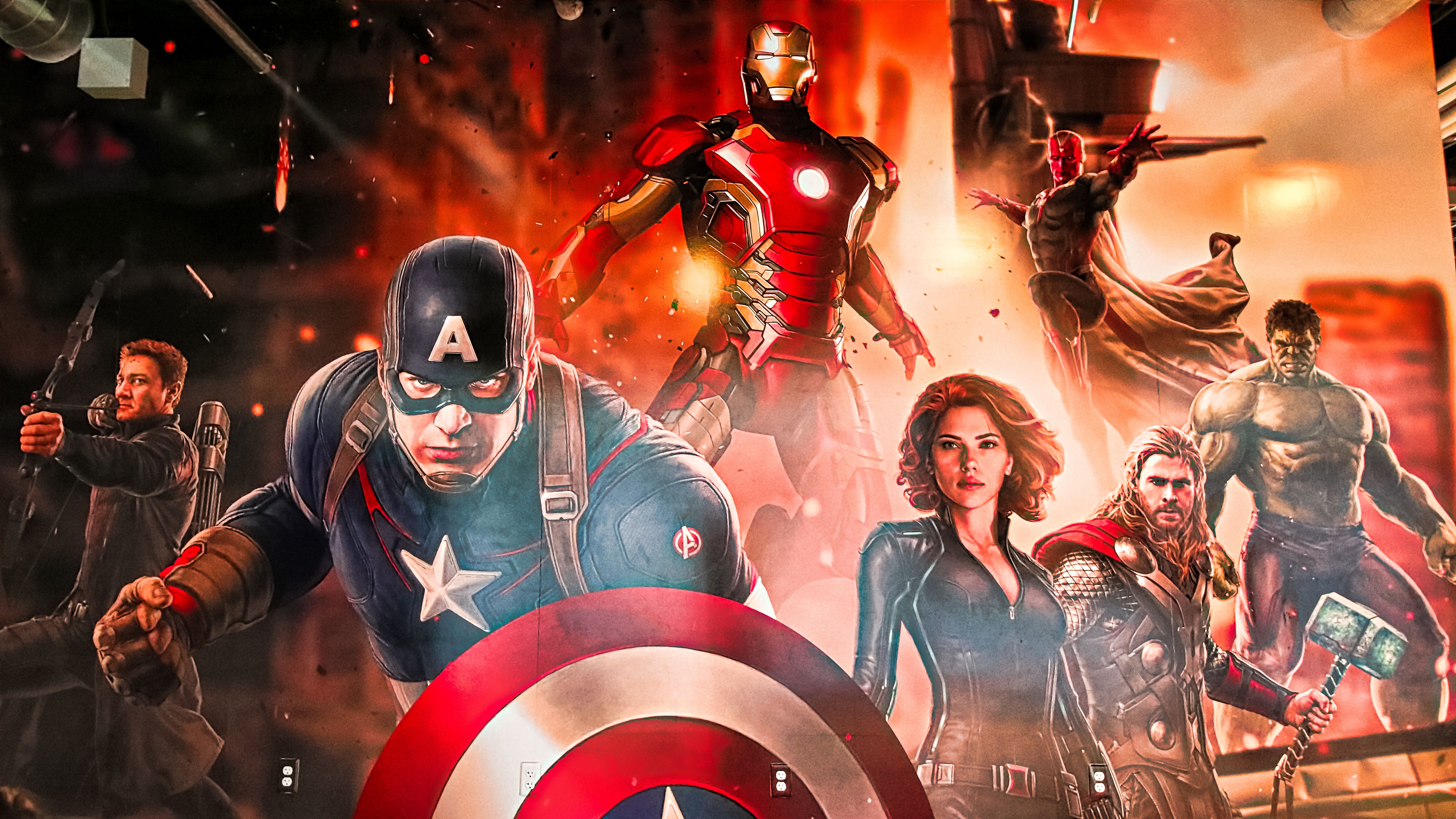 Personagens da Marvel reunidos: Gavião Arqueiro, Capitão América, Homem de Ferro, Viúva Negra, Thor, Hulk e Visão.
